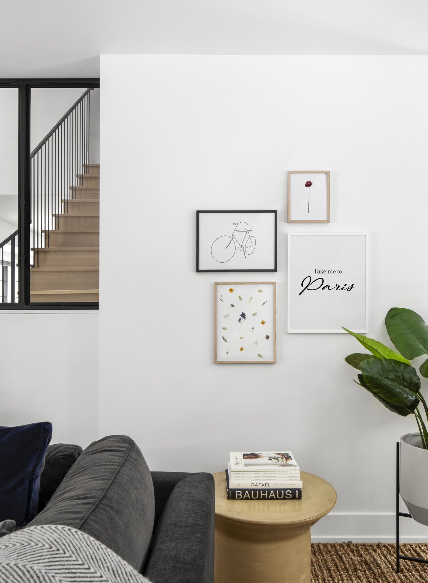 Scandinavian poster by Opposite Wall with black and white graphic typography design of Take my to Paris - Living room with gallery wall quadruple
