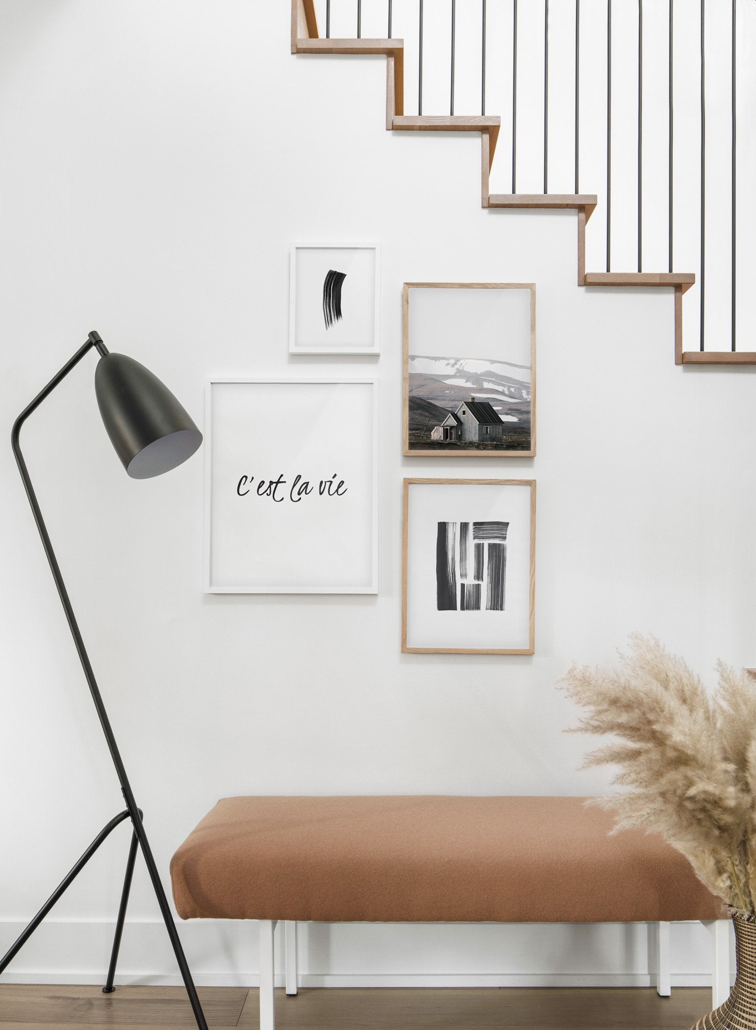 Scandinavian poster by Opposite Wall with black and white graphic typography design of C'est la vie - Hallway with staircase - gallery wall