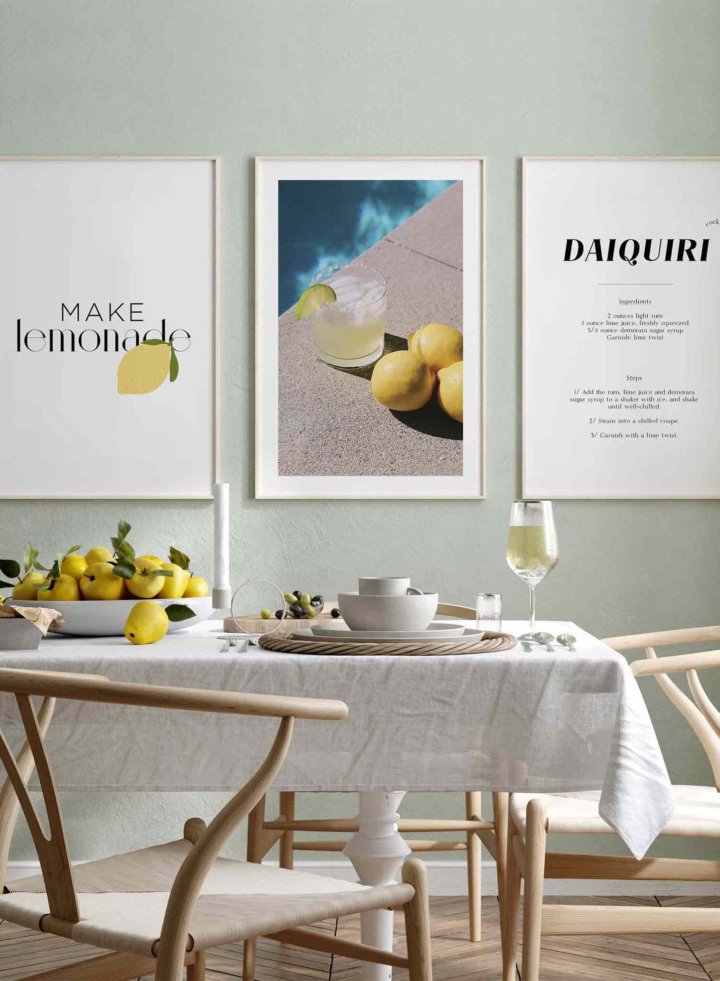 Summer Sip is a minimalist photography poster of a glass of cocktail next to lemons by Opposite Wall.