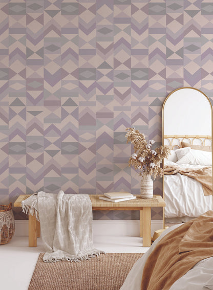 Tangram is a minimalist wallpaper by Opposite Wall of various vertical arrangements of colourful triangles.