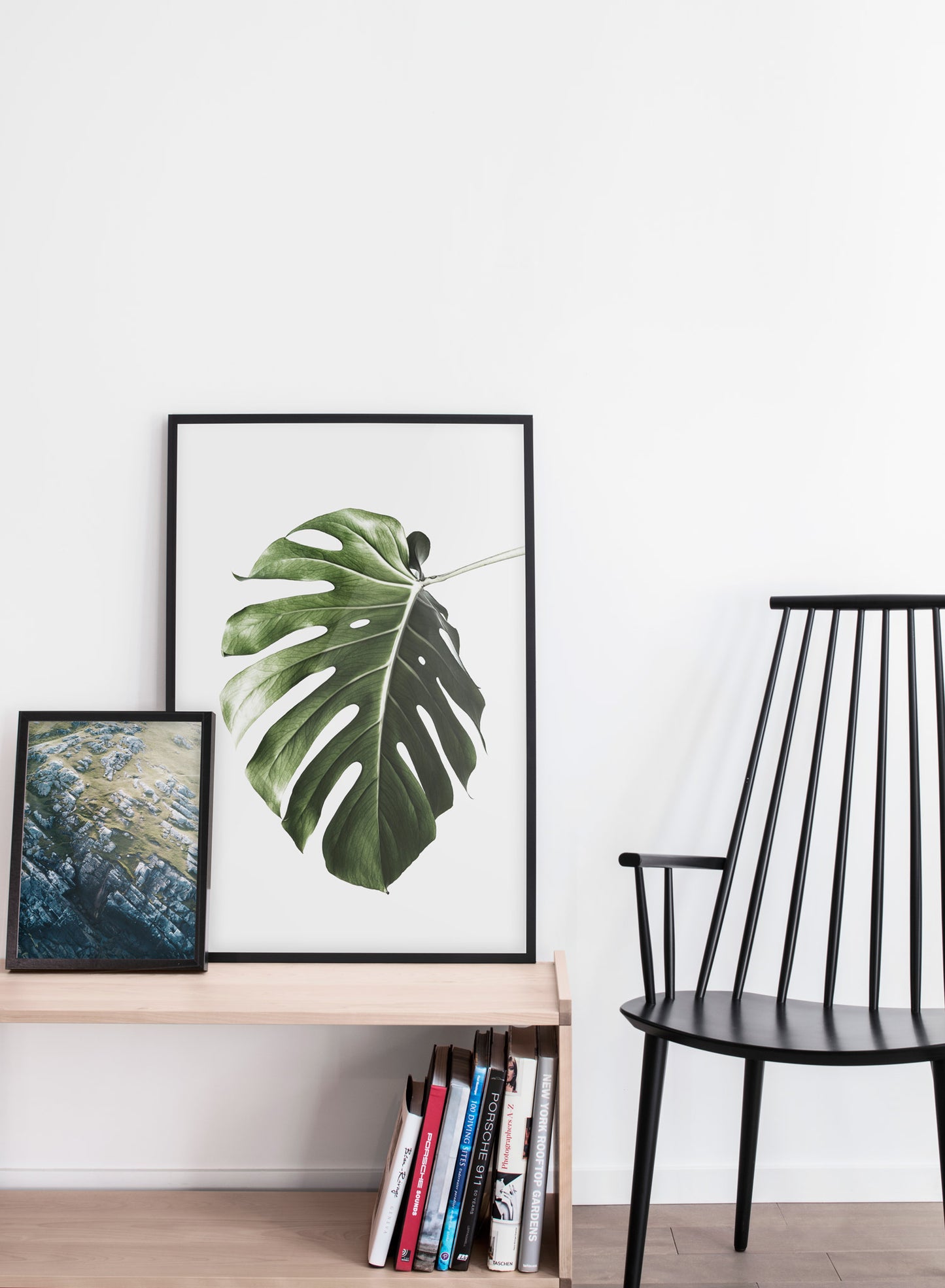 Scandinavian poster by Opposite Wall with art photo of botanical leaf called Upside Down - Living room with a black chair