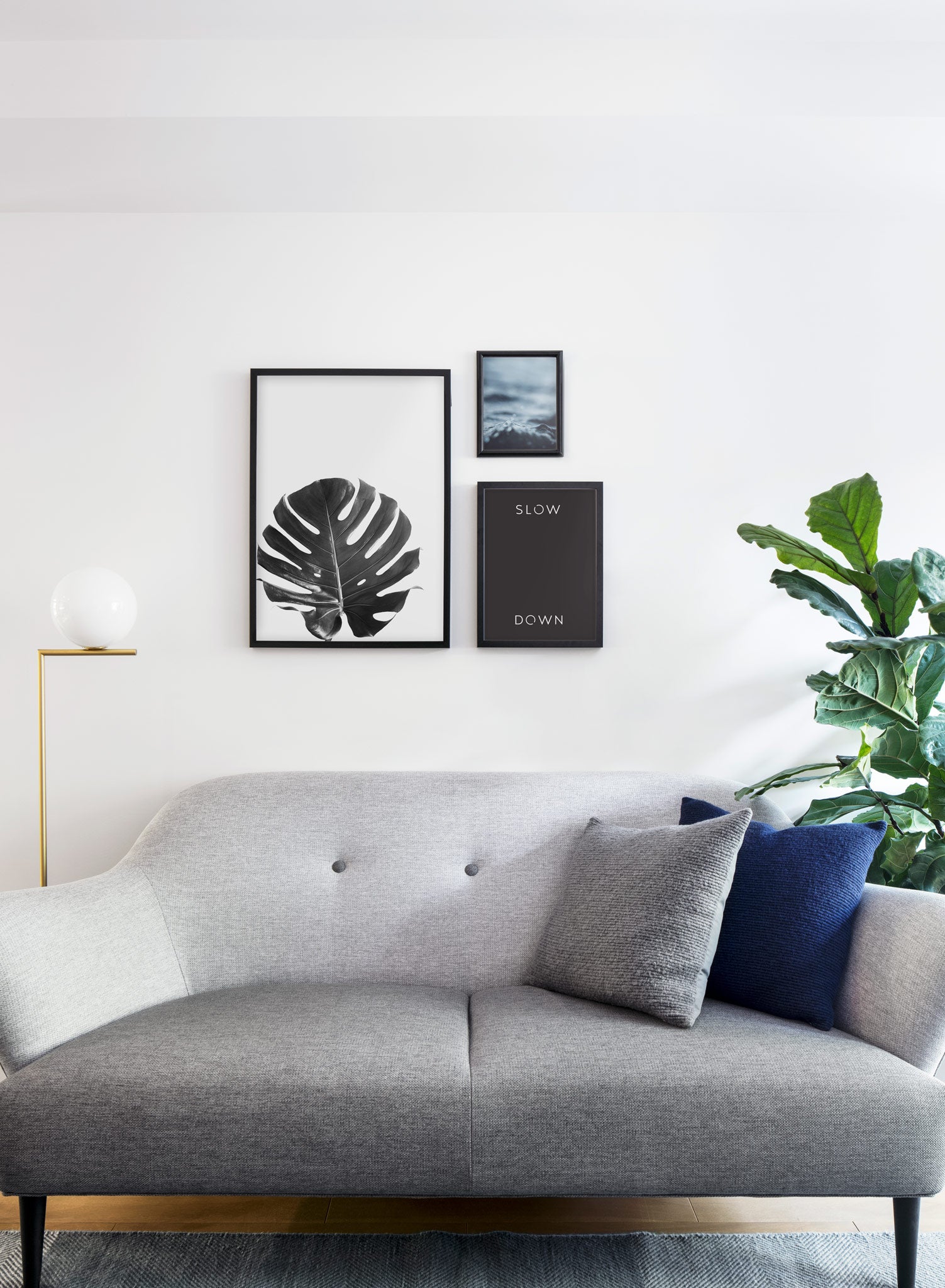 Scandinavian poster by Opposite Wall with graphic Slow _ Down typo design - Living room couch
