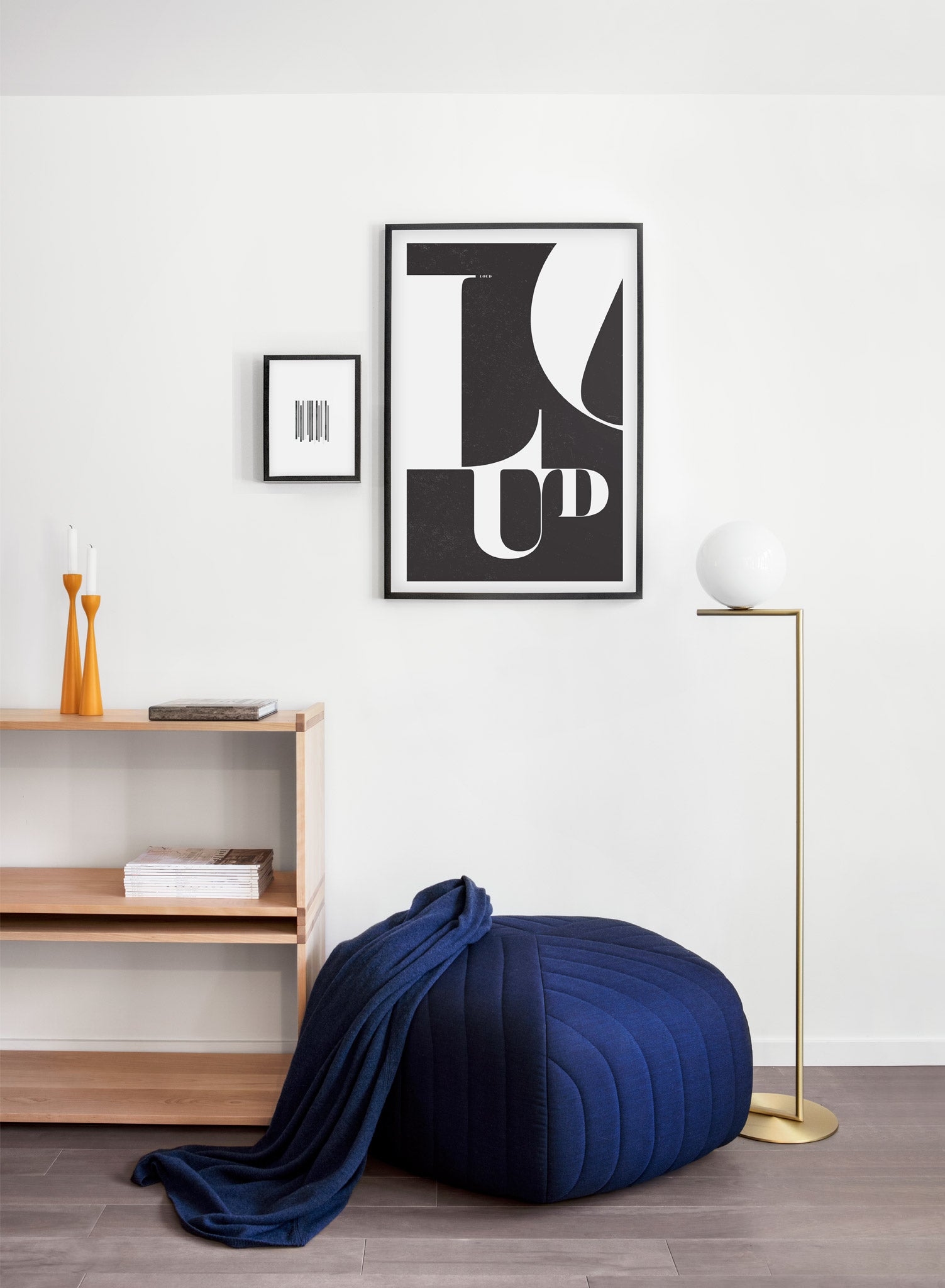 Scandinavian poster by Opposite Wall with trendy black and white typo design featuring the word LOUD - Living room with a pouf