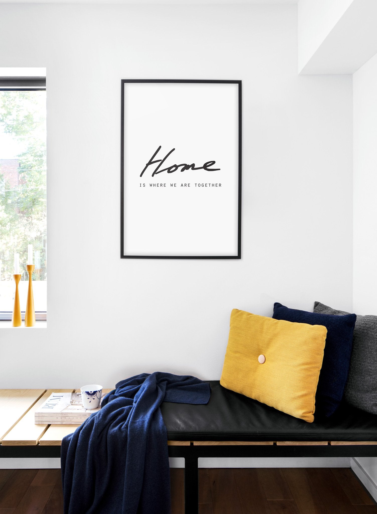 Scandinavian poster with black and white graphic typography design of Home is where we are together - Cozy living room nook