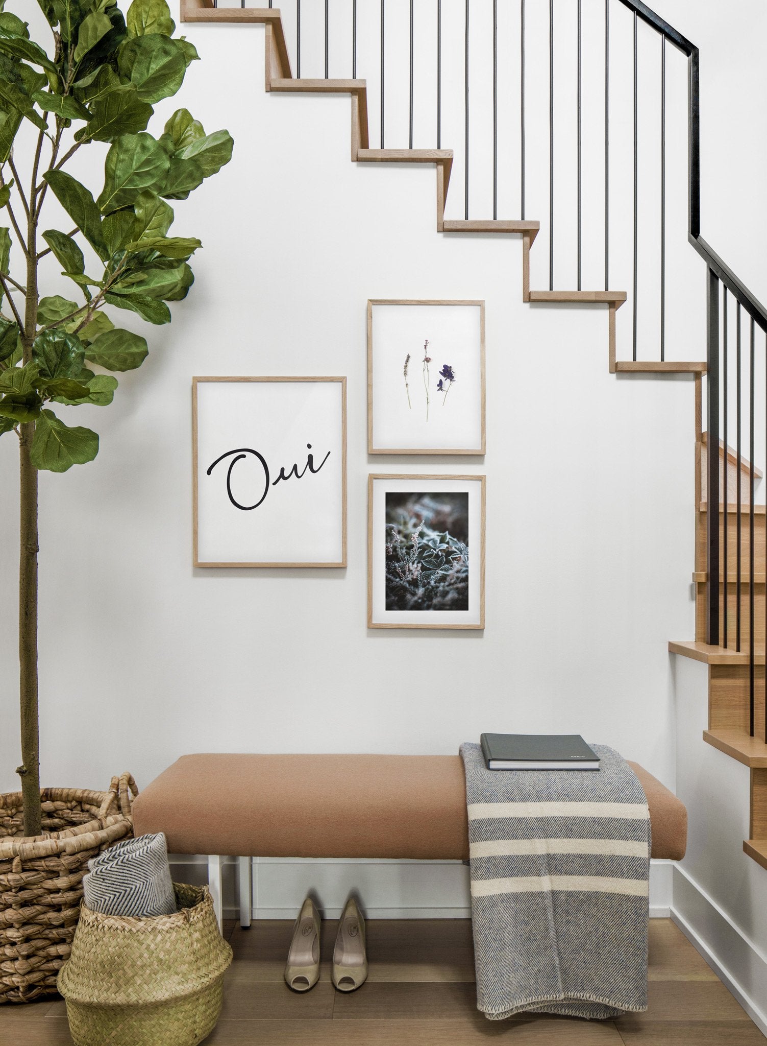 Scandinavian poster by Opposite Wall with black and white graphic typography design of Oui - Hallway with gallery wall trio