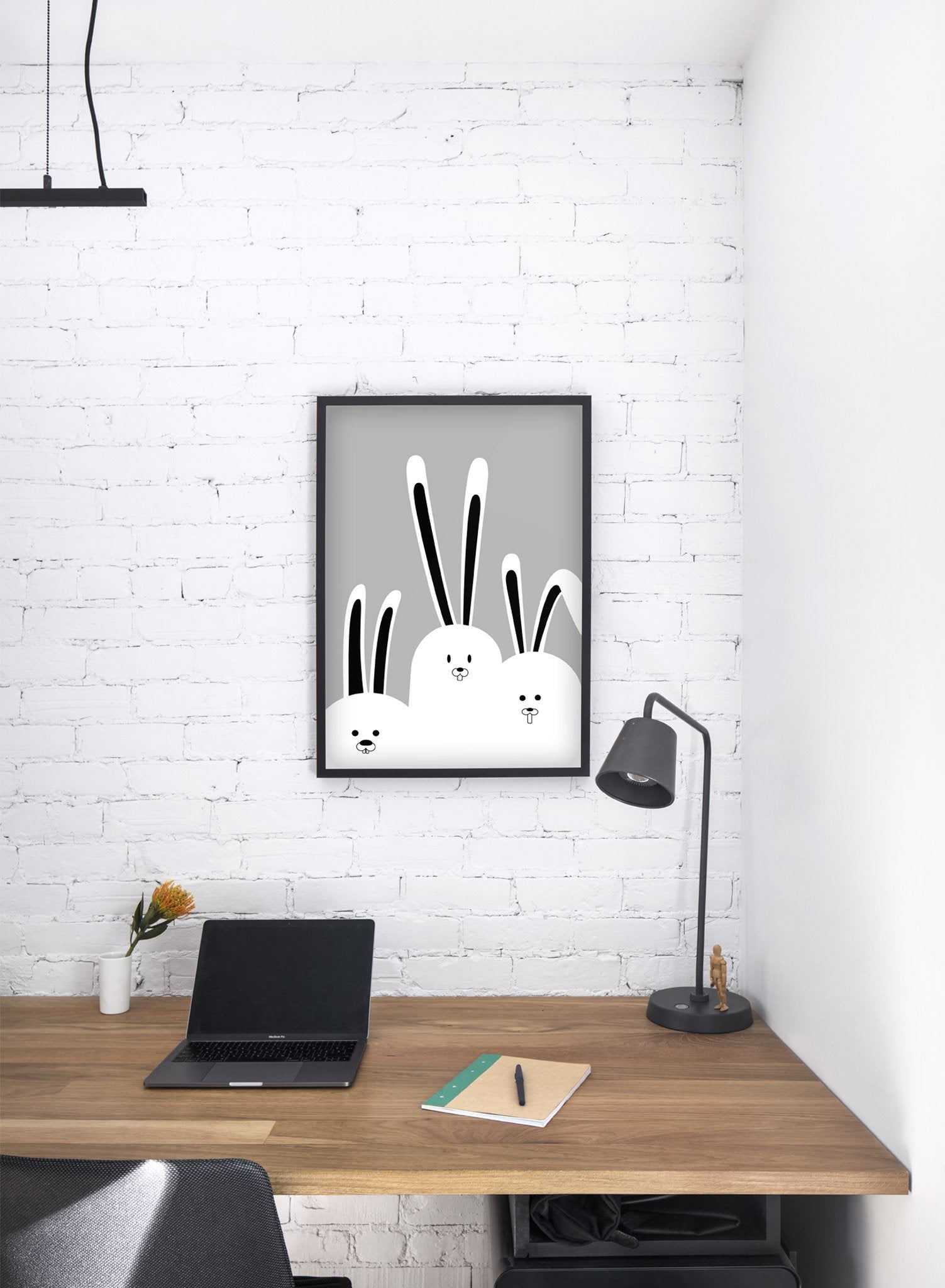 Modern minimalist poster by Opposite Wall with an illustration of a rabbit family in black and white - kids collection - desk