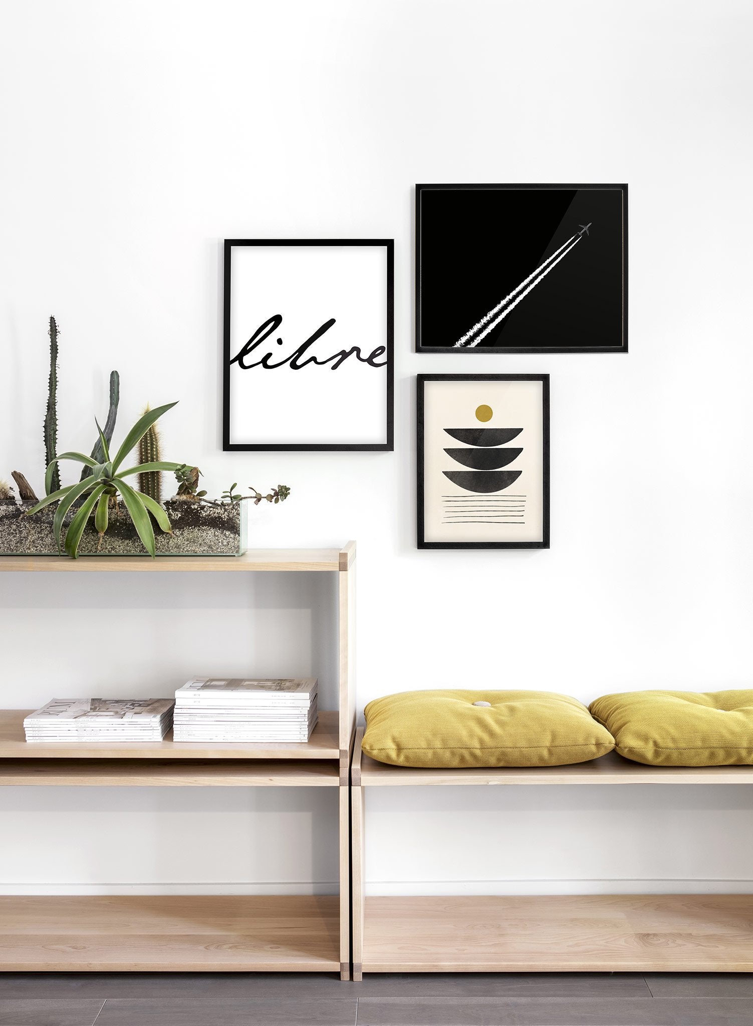 Modern minimalist poster by Opposite Wall with black and white photography of airplane contrail - Lifestyle Trio - Entryway