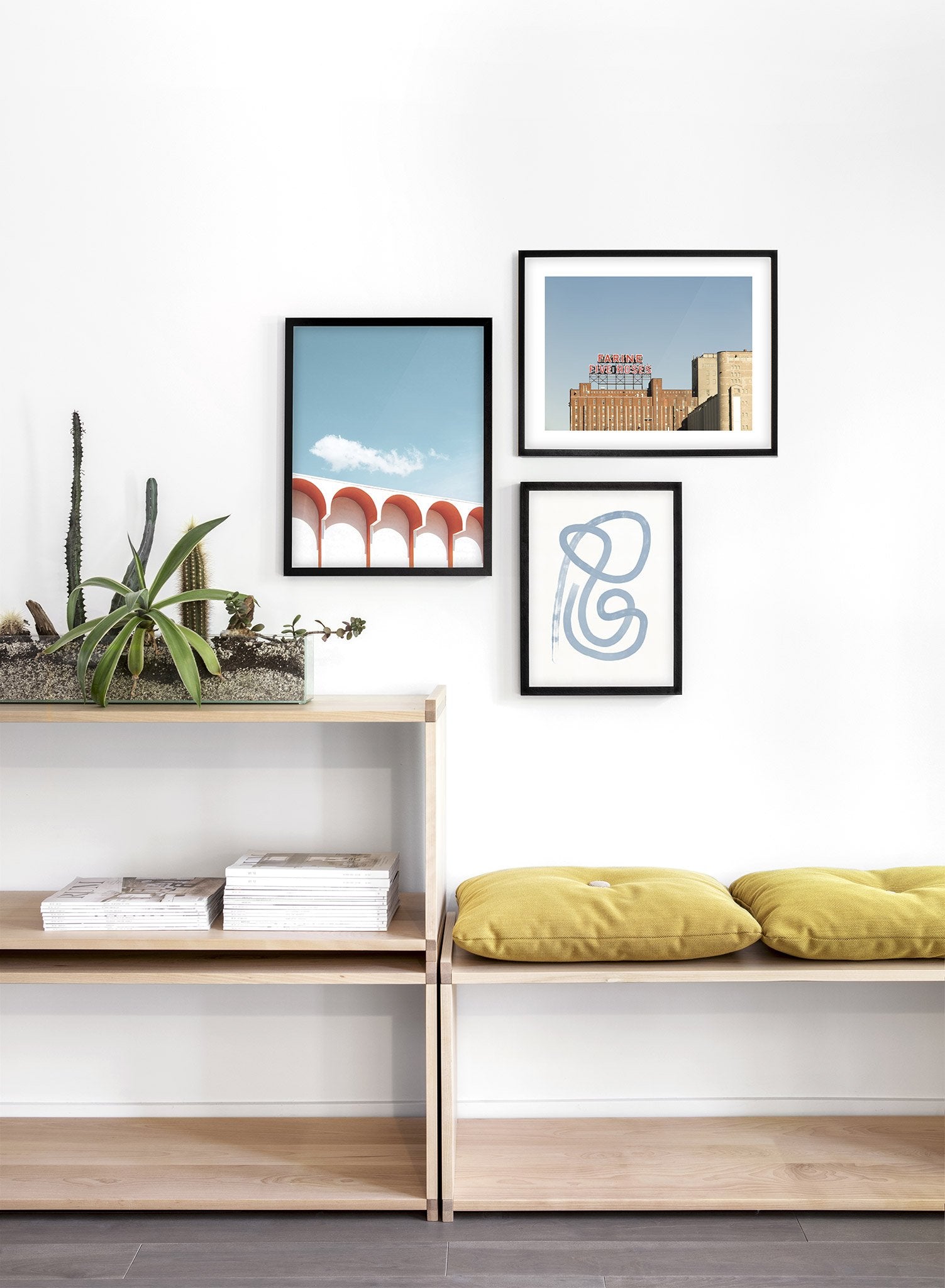 Modern minimalist poster by Opposite Wall with photography of white building with red arches - Lifestyle Trio - Living Room