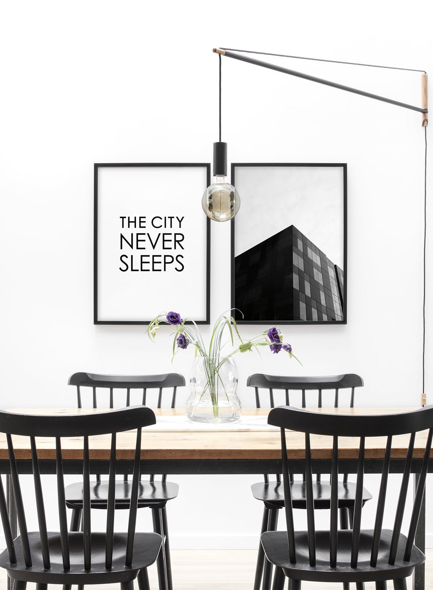 Scandinavian poster with black and white graphic typography design of The City Never Sleeps text by Opposite Wall - Lifestyle Duo - Dining Room