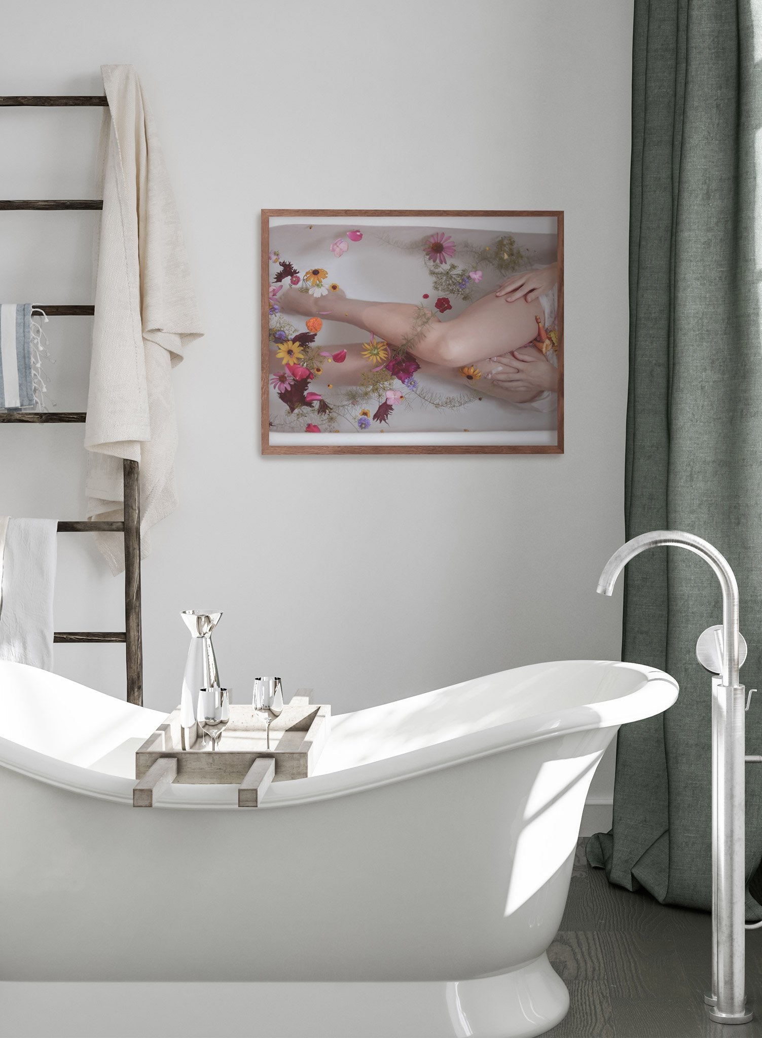 "Bloom Bath" is a minimalist photography poster by Opposite Wall of a woman sitting in a bath with bright multi colored flowers in yellow, pink and purple.