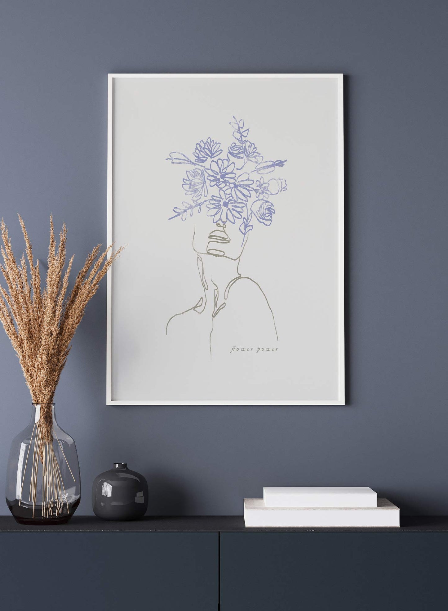 Flourishing is a line art illustration of a person wearing a blue flower crown covering half the face by Opposite Wall.