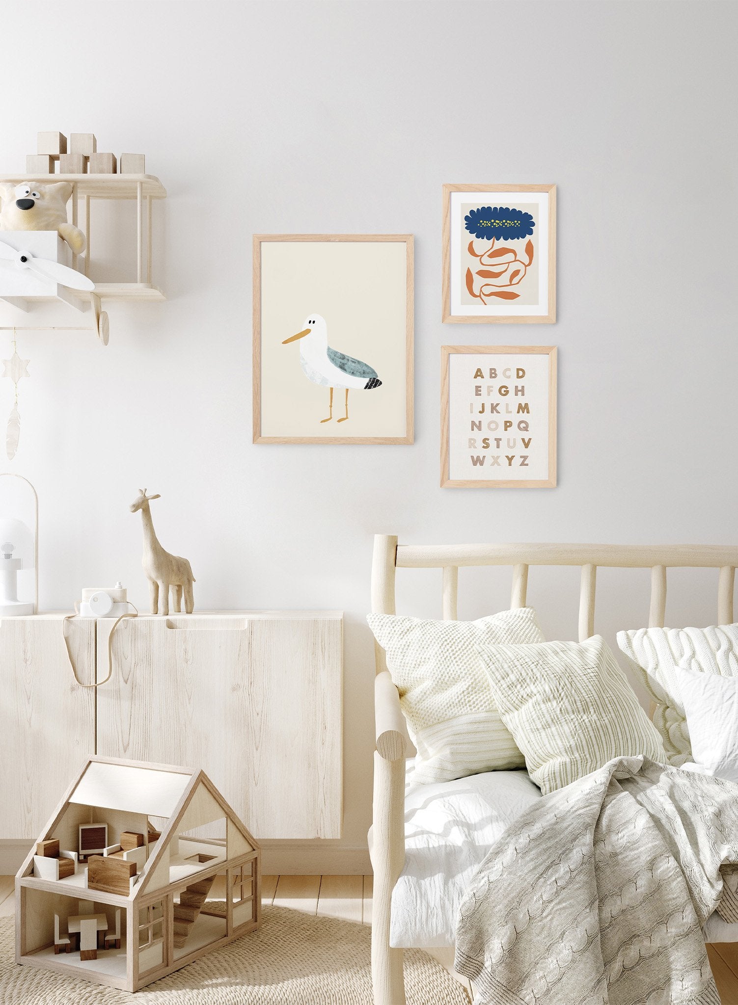 Sweet Seagull is a minimalist illustration of a white seagull with teal-coloured wings starring at the observer by Opposite Wall.