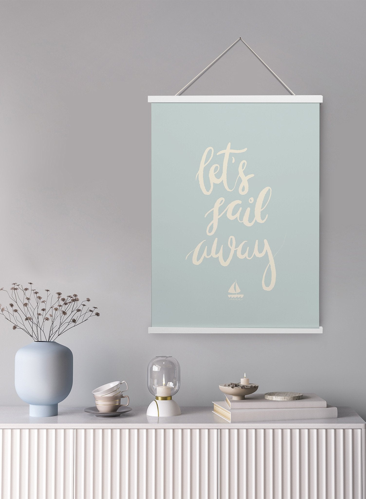 Adventure At Sea is a minimalist illustration and typography of the words "Let's sail away" written cursively with a boat at the bottom by Opposite Wall.