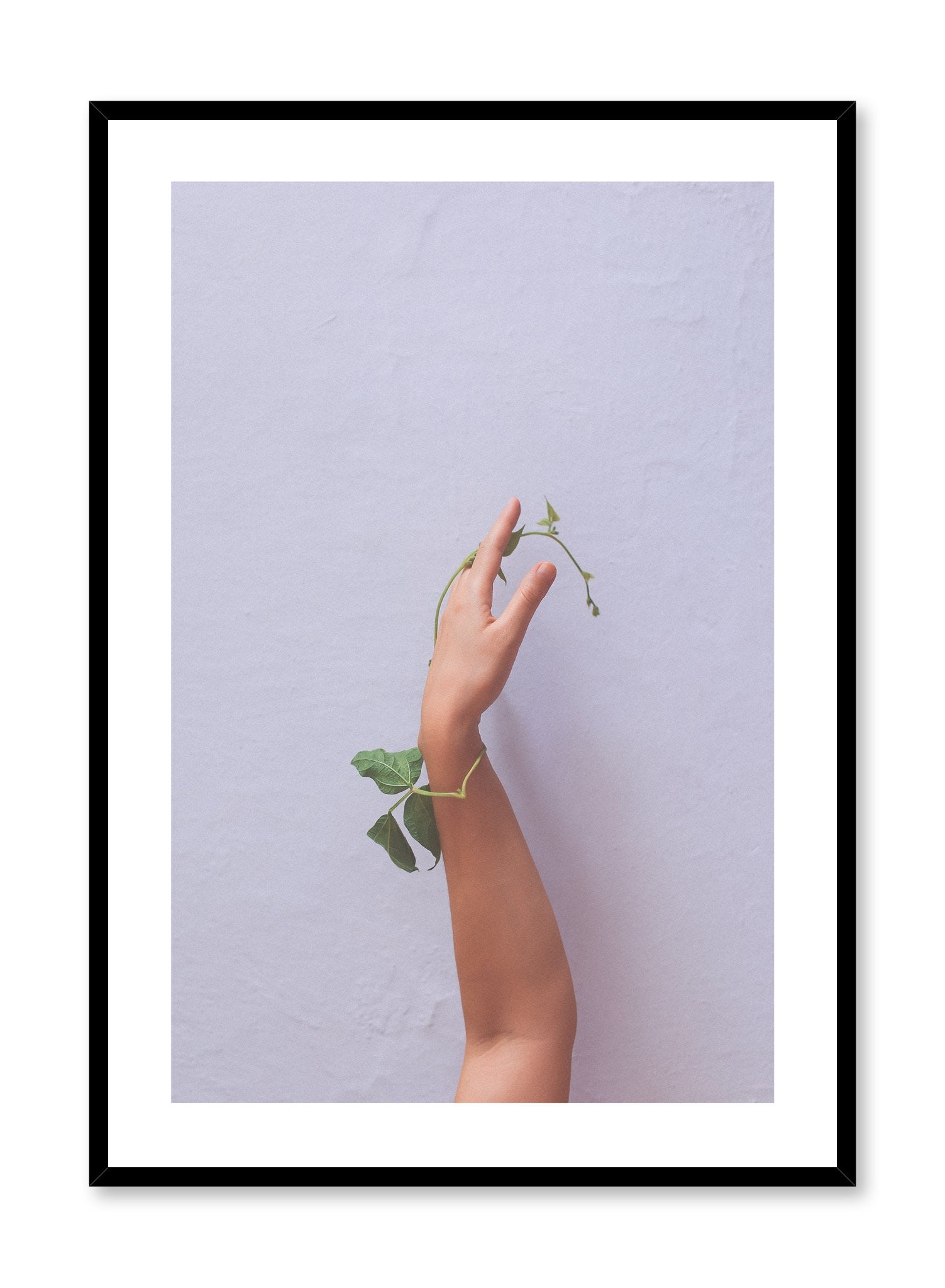 "Skin & Foliage" is a minimalist photography poster by Opposite Wall of a nude arm and hand entangled with a green leafy stem.