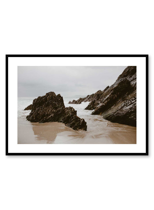 Irish Boulders' is a landscape photography poster by Opposite Wall of tall rock boulders on a cloudy and peaceful beach in Ireland.