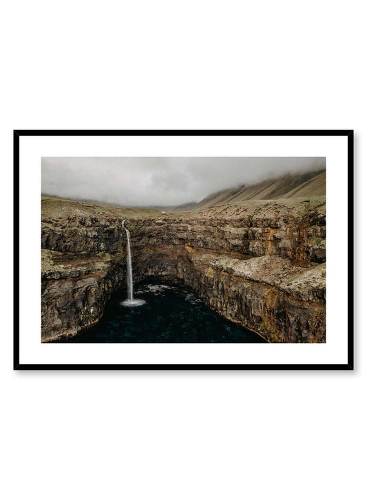 Nebulous' is a landscape photography poster by Opposite Wall of a small waterfall rushing down a wide rocky cliff toward the calm water of a lake.
