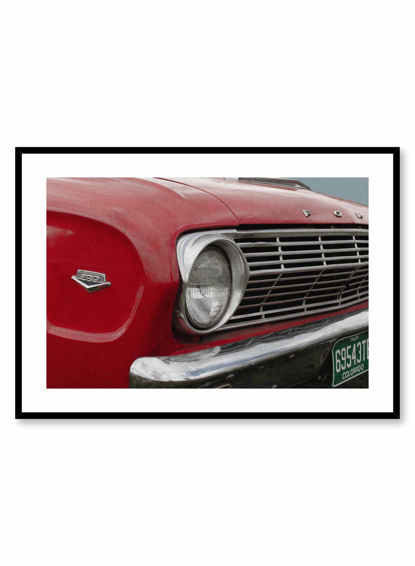 ‘50s Bumper is a vintage photography poster of a red Ford car's bumper by Opposite Wall.