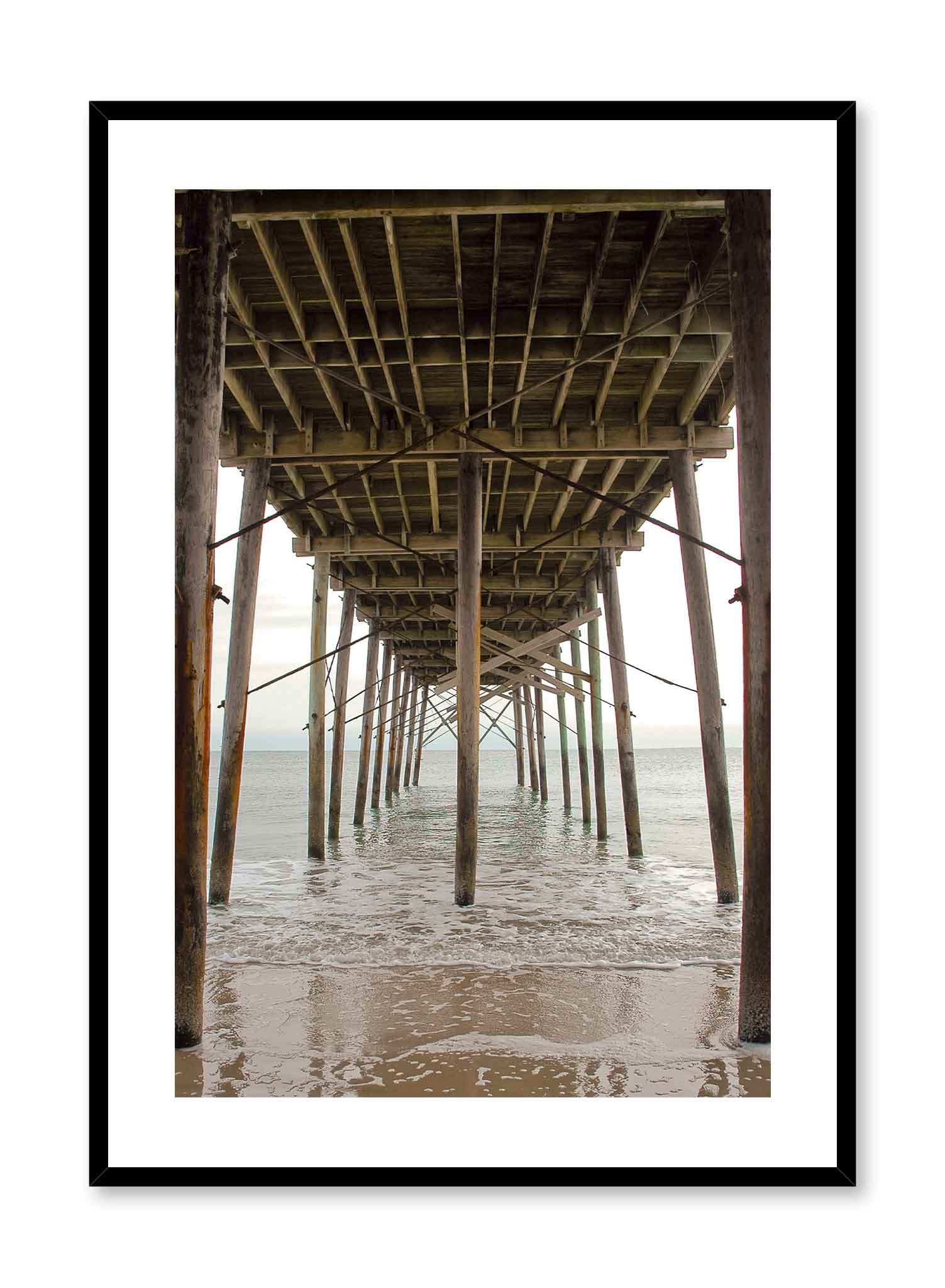 Beach House is a minimalist photography of an underview of a beach dock where waves are calmly flowing under by Opposite Wall.
