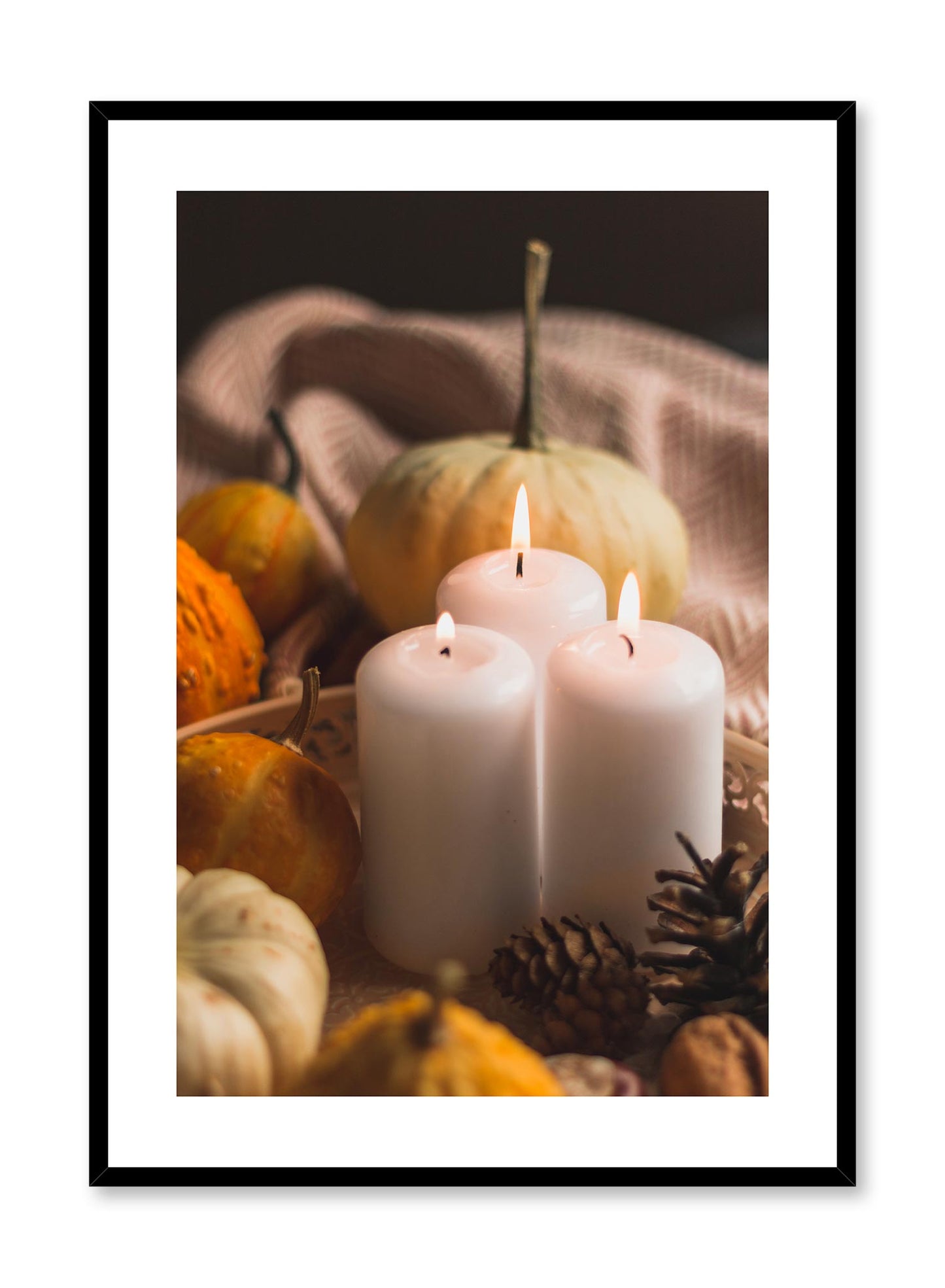 Candlelit is a minimalist photography by Opposite Wall of three lit candles surrounded by small pumpkins.