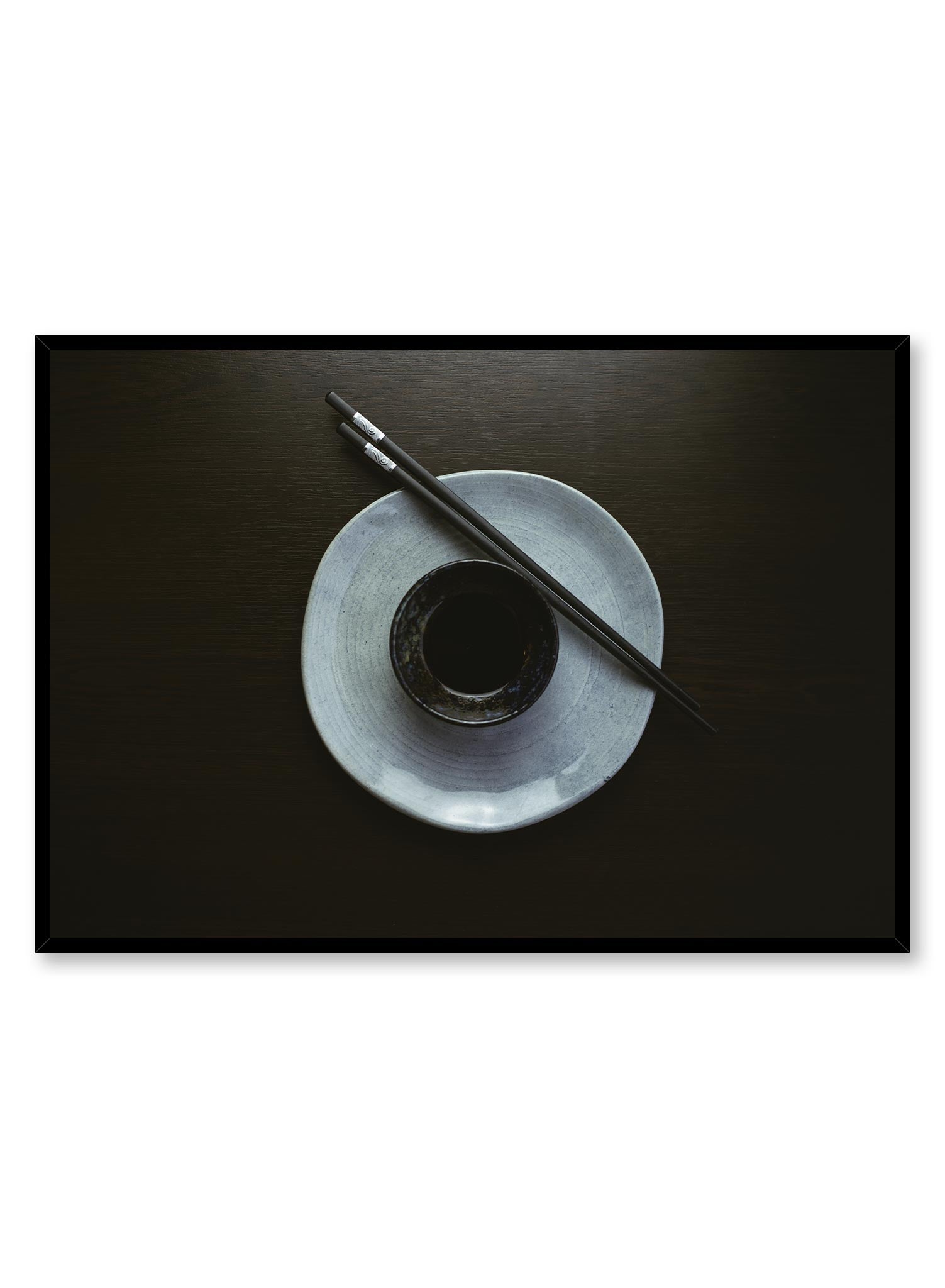 Inku is a minimalist photography by Opposite Wall of a pair of chopsticks on a plate with a saucer in the center.